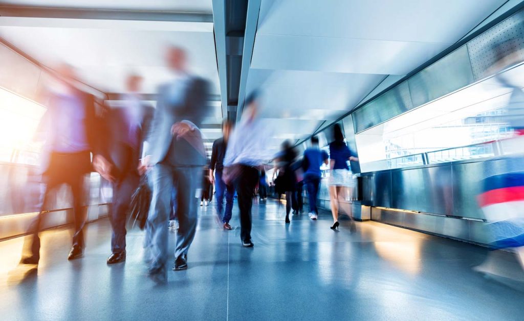 people moving through an airport