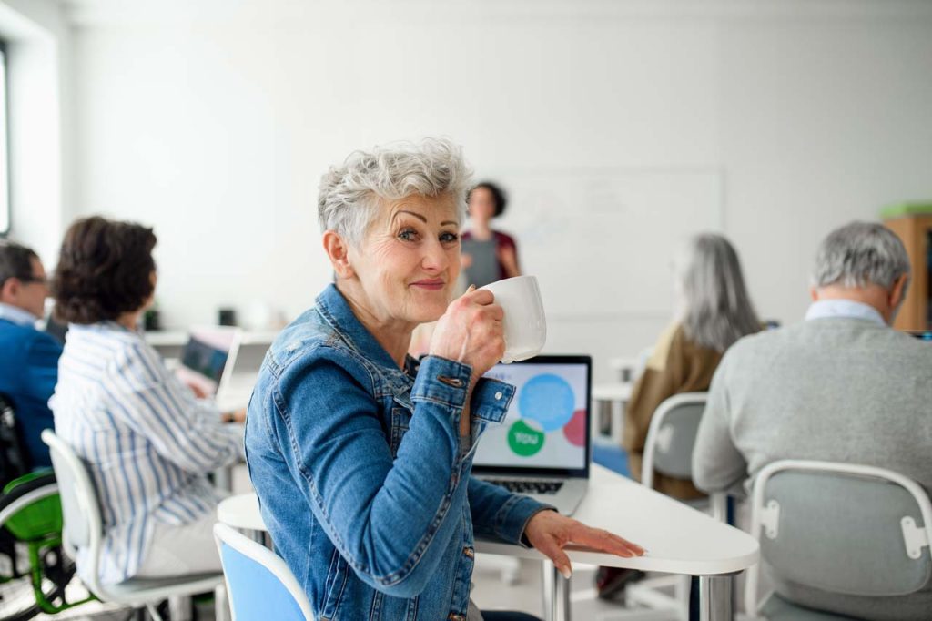 senior woman in a classroom