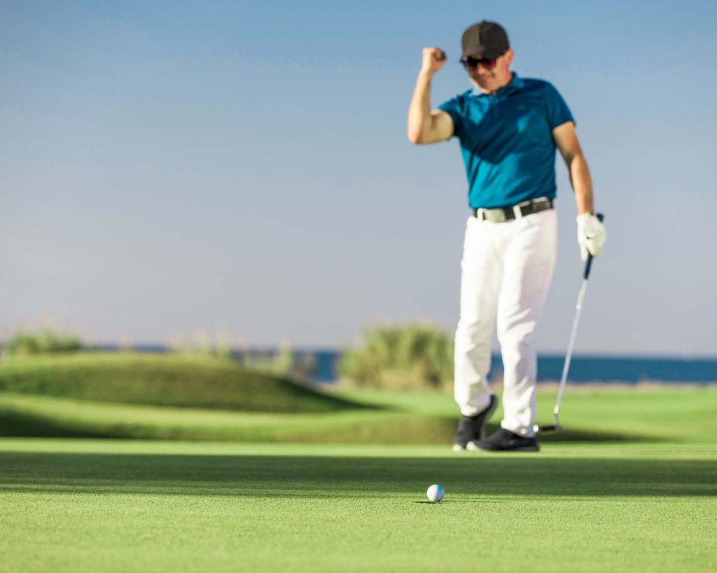 Golfer just barely misses a putt